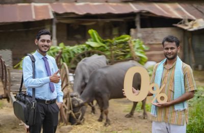 Young indian farmer showing zero percent symbol with agronomist or financier at his cattle farm
